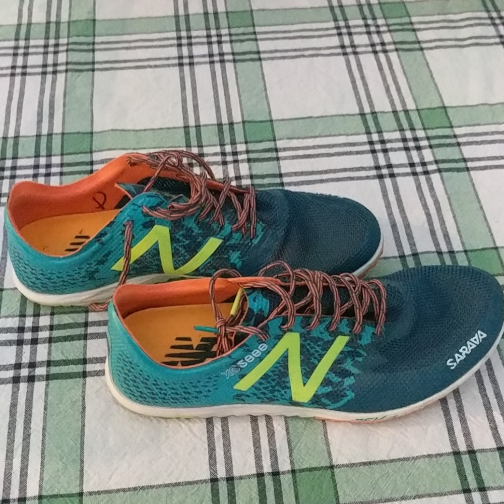 Track shoes with spikes and key.